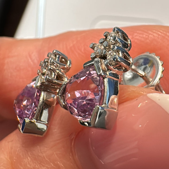 Trillion-cut purple sapphire and diamond stud earrings set in 14K white gold.