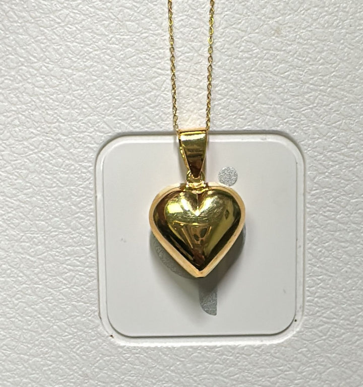 Shiny 18K gold heart pendant with a 10K gold chain, classic and elegant.