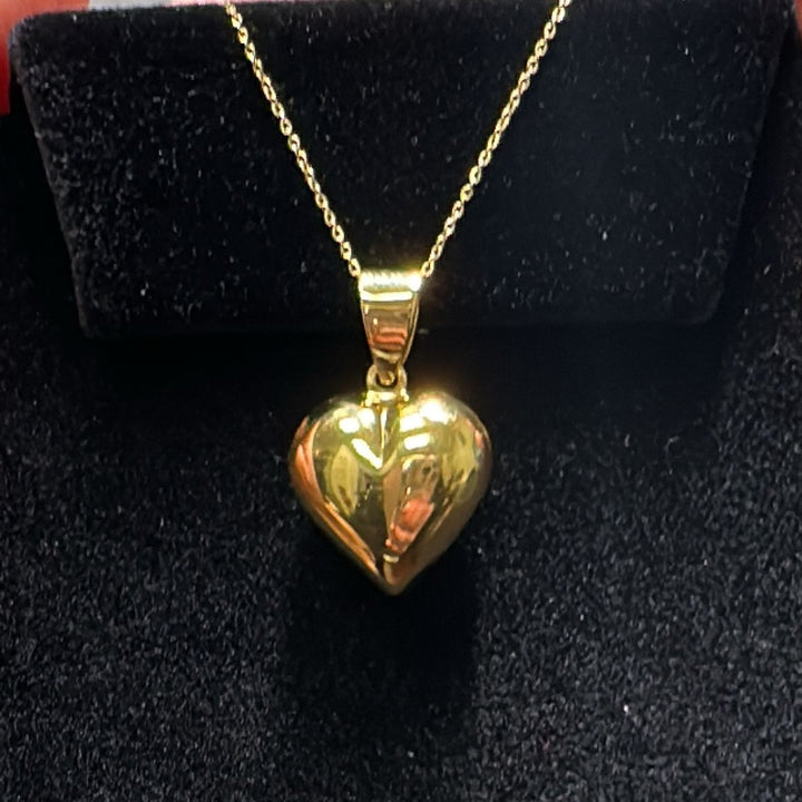 Shiny 18K gold heart pendant with a 10K gold chain, classic and elegant.