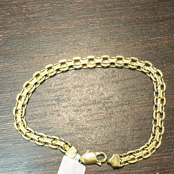 14K yellow gold double link chain bracelet, 8g weight, with a lobster clasp.