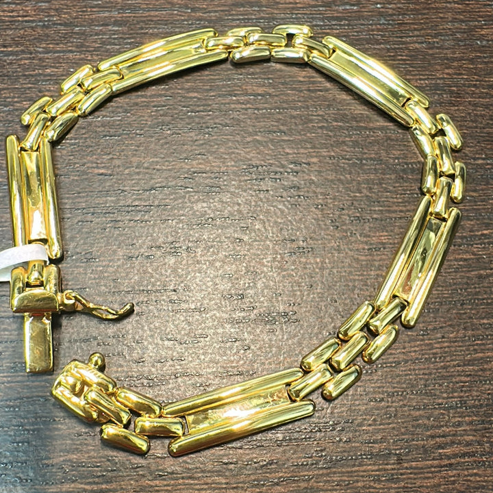 14K yellow gold polished link bracelet, 6.39mm width, 6.85g weight, with a box clasp.