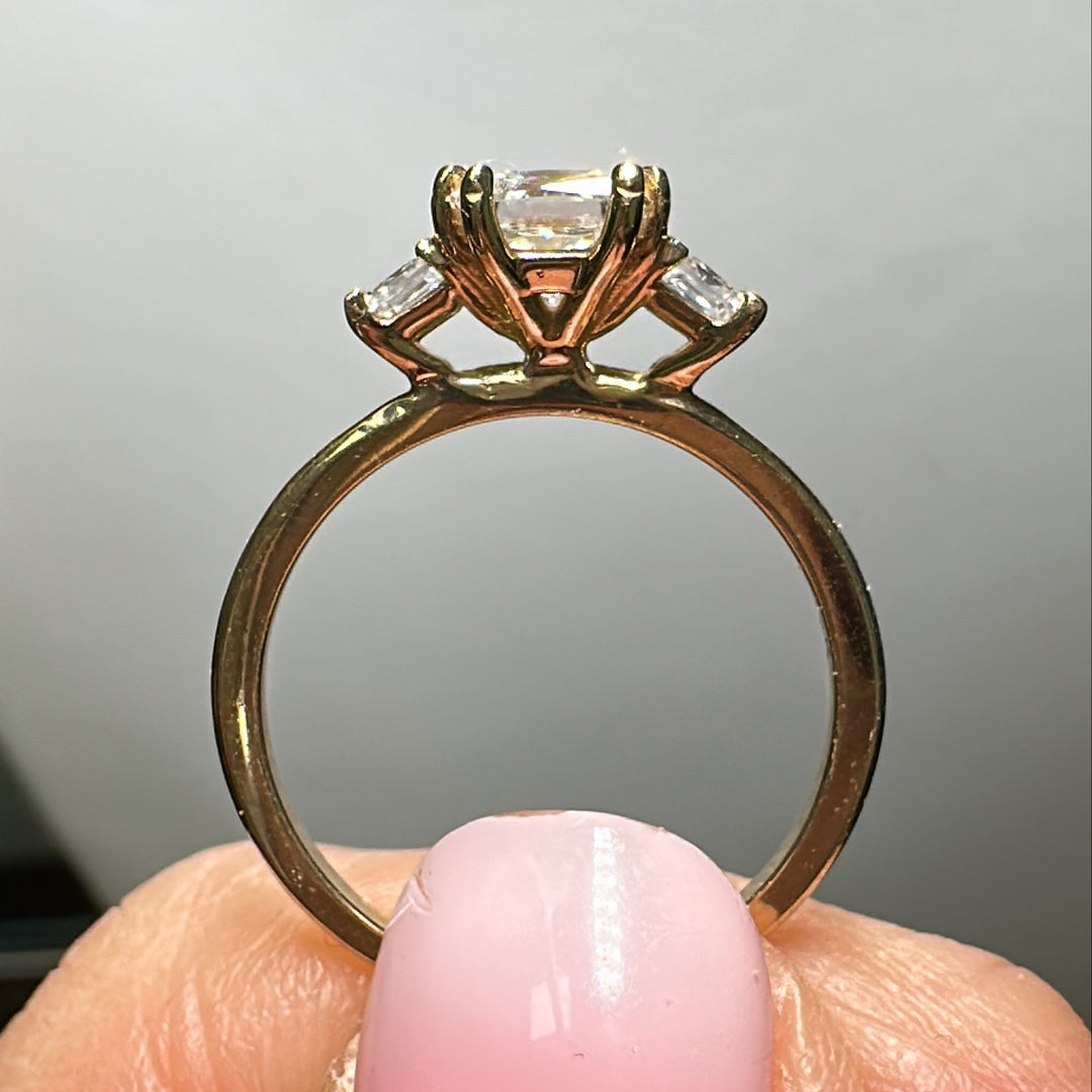 3-stone princess cut moissanite ring with 0.90CT center stone and two side stones, set in 14K gold.