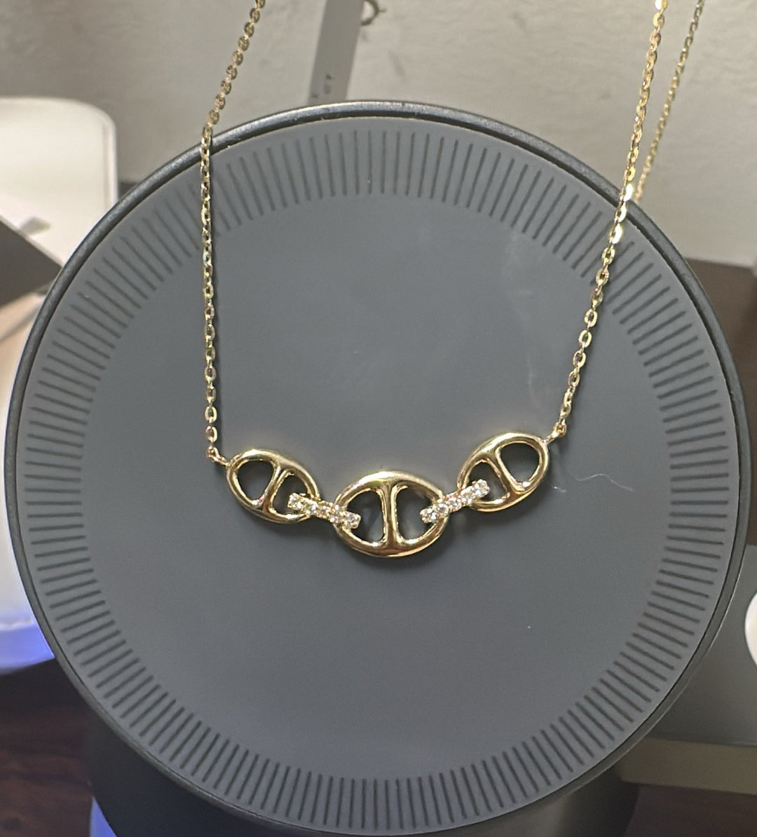 14K yellow gold peace symbol necklace with 0.04ct diamonds and adjustable chain