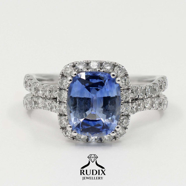 Cushion-cut 2.46 CT blue sapphire ring with 1.42 CT natural diamonds set in 14K white gold.