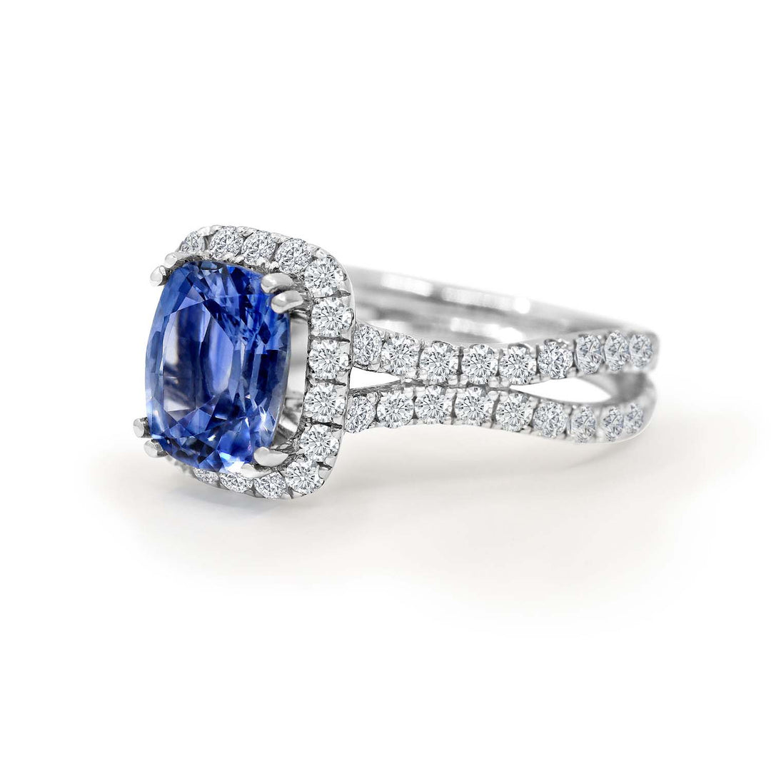 Cushion-cut 2.46 CT blue sapphire ring with 1.42 CT natural diamonds set in 14K white gold.