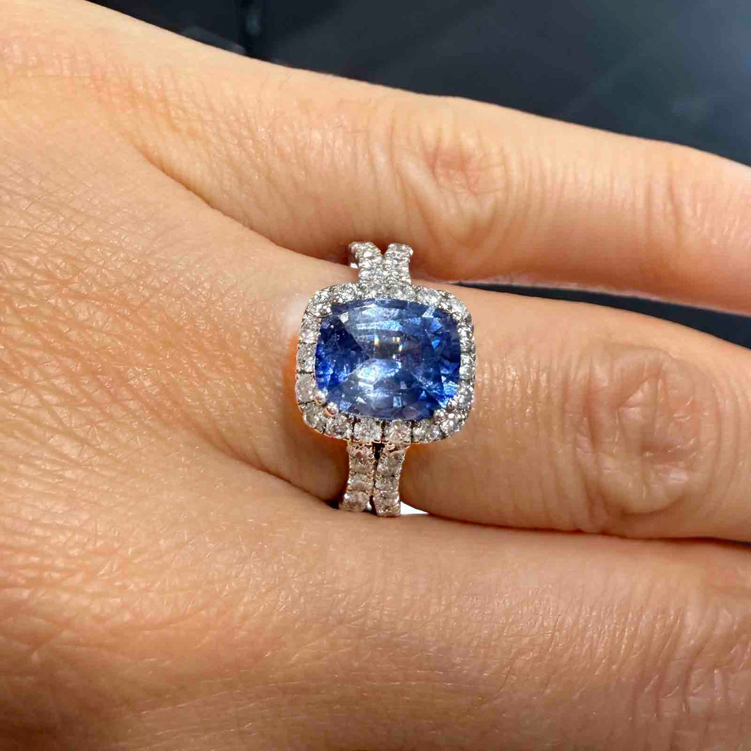 Cushion-cut 2.46 CT blue sapphire ring with 1.42 CT natural diamonds set in 14K white gold.