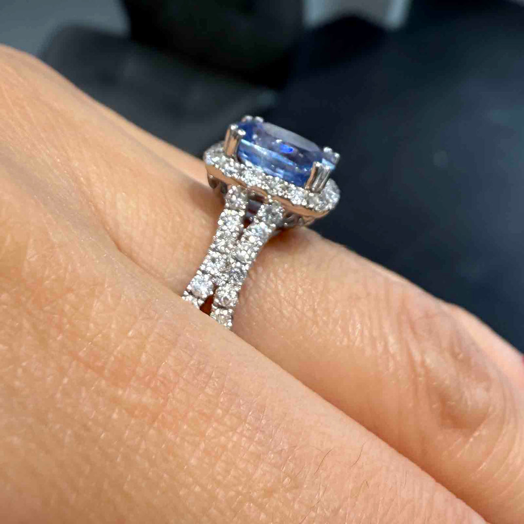 Cushion-cut 2.46 CT blue sapphire ring with 1.42 CT natural diamonds set in 14K white gold.