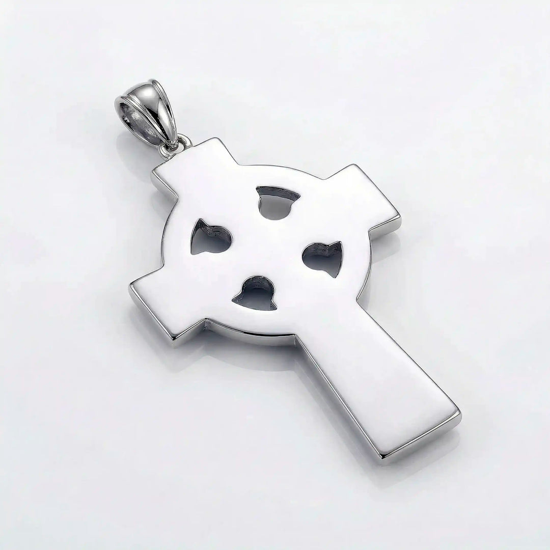 Celtic knot cross pendant necklace with circular halo design displayed on white background.