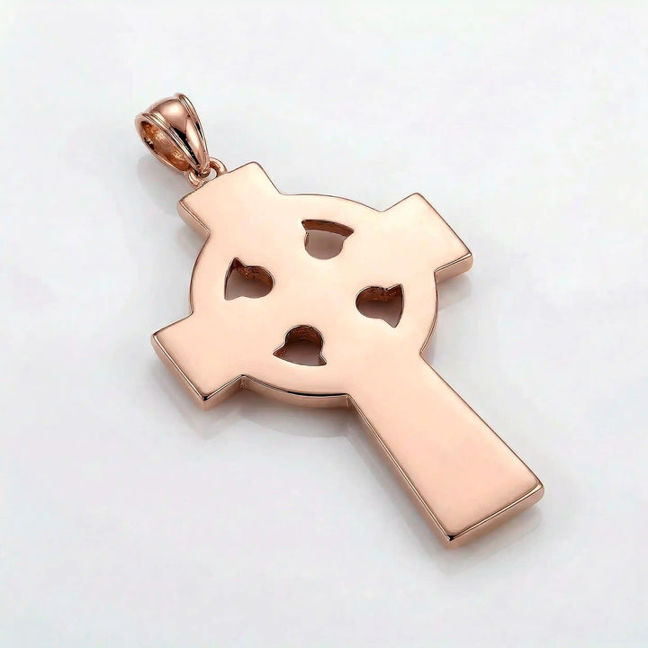 Celtic knot cross pendant necklace with circular halo design displayed on white background.