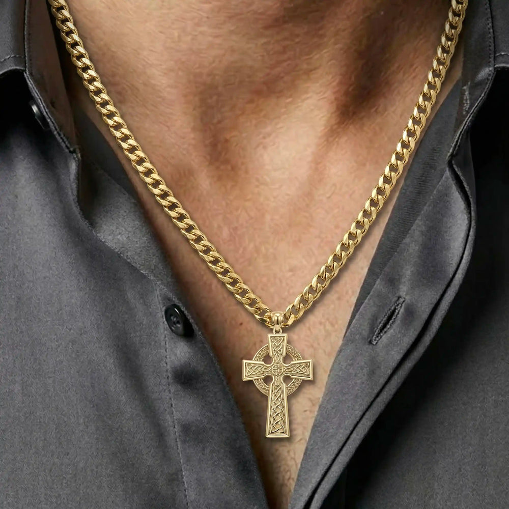 Celtic knot cross pendant necklace with circular halo design displayed on chest.