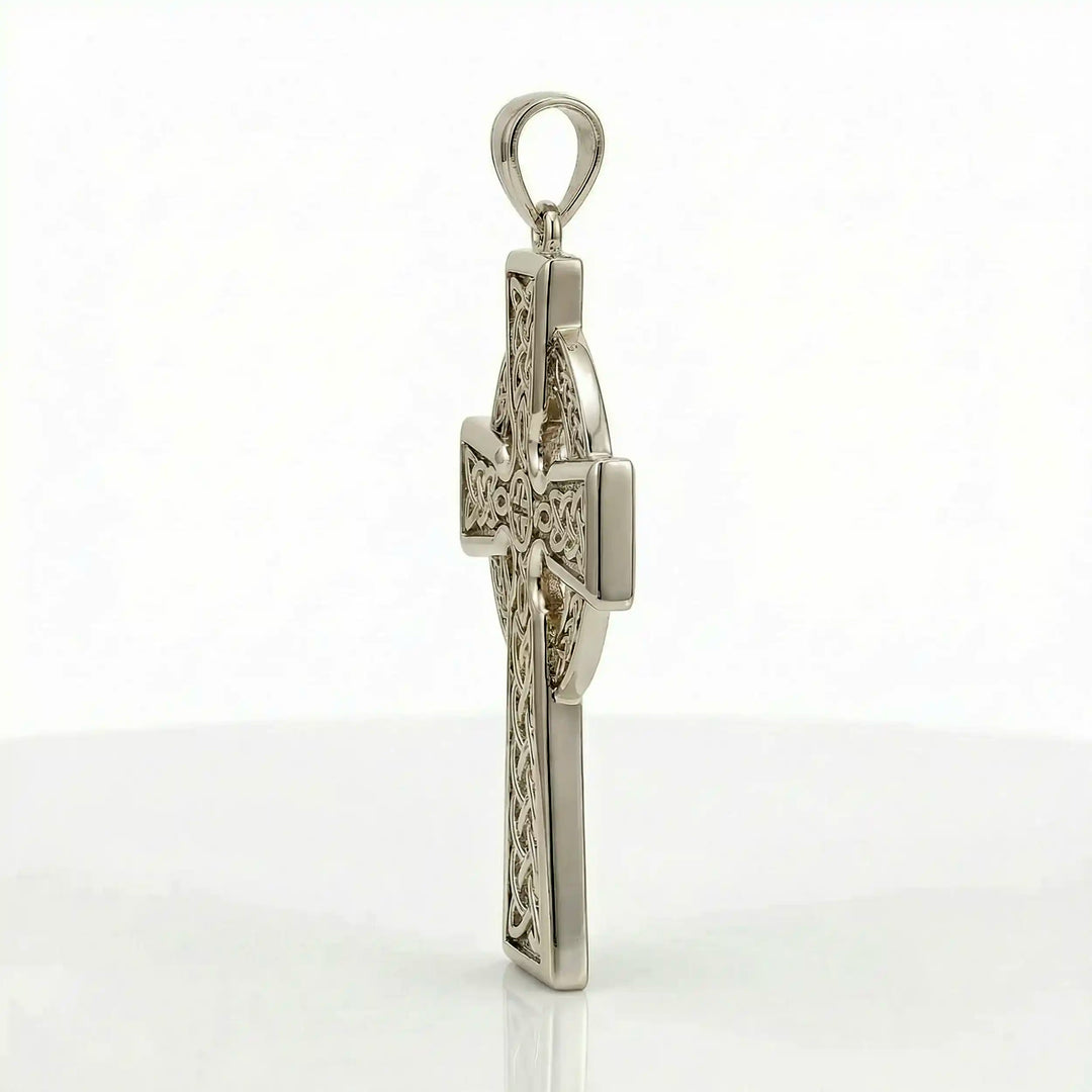 Celtic knot cross pendant necklace with circular halo design displayed on white background.