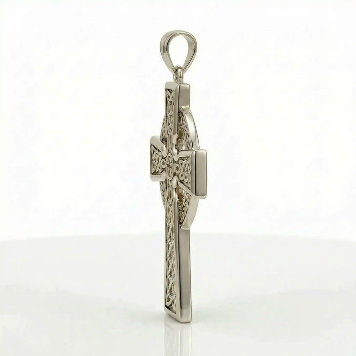 Celtic knot cross pendant necklace with circular halo design displayed on white background.