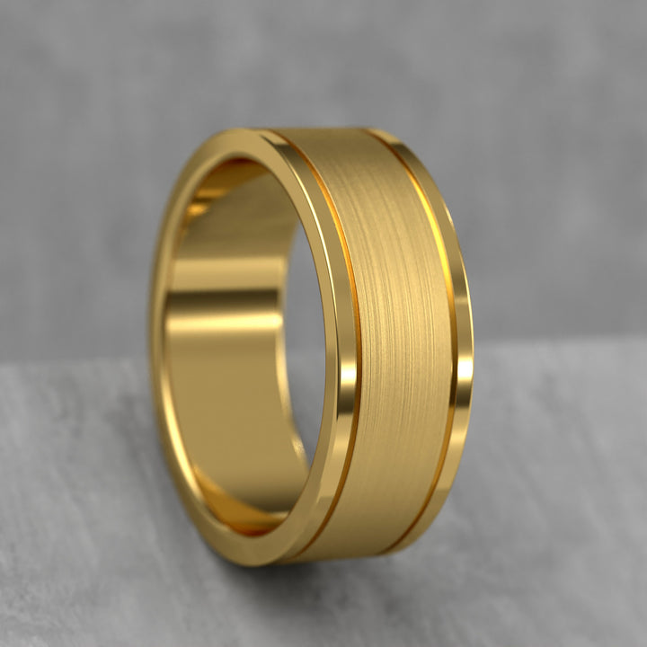 Center brushed men’s wedding band with polished double grooves