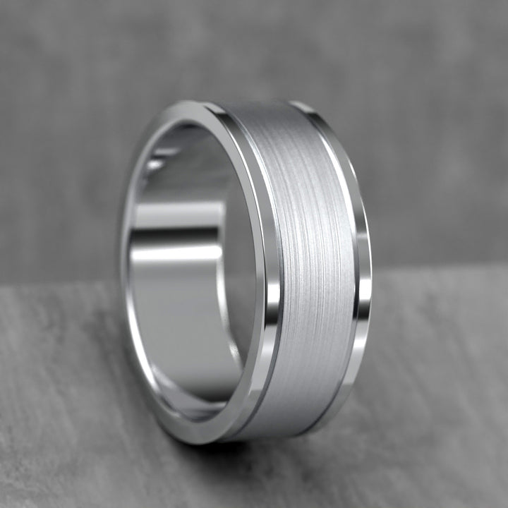 Center brushed men’s wedding band with polished double grooves