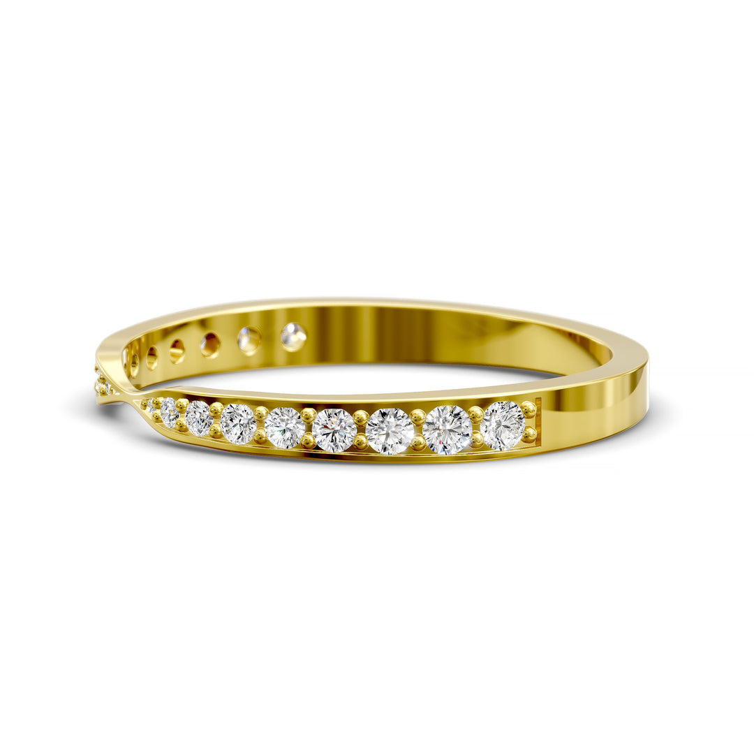 Channel set gold wedding band with tapered top and round brilliant stones