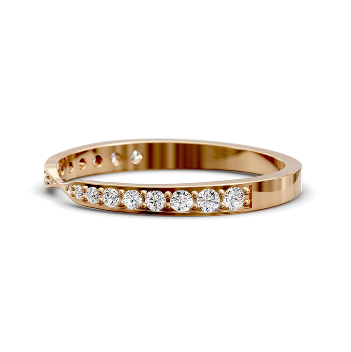 Channel set gold wedding band with tapered top and round brilliant stones