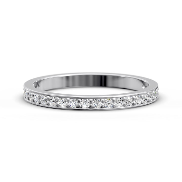 Channel set three-quarter eternity ring with round stones in polished gold