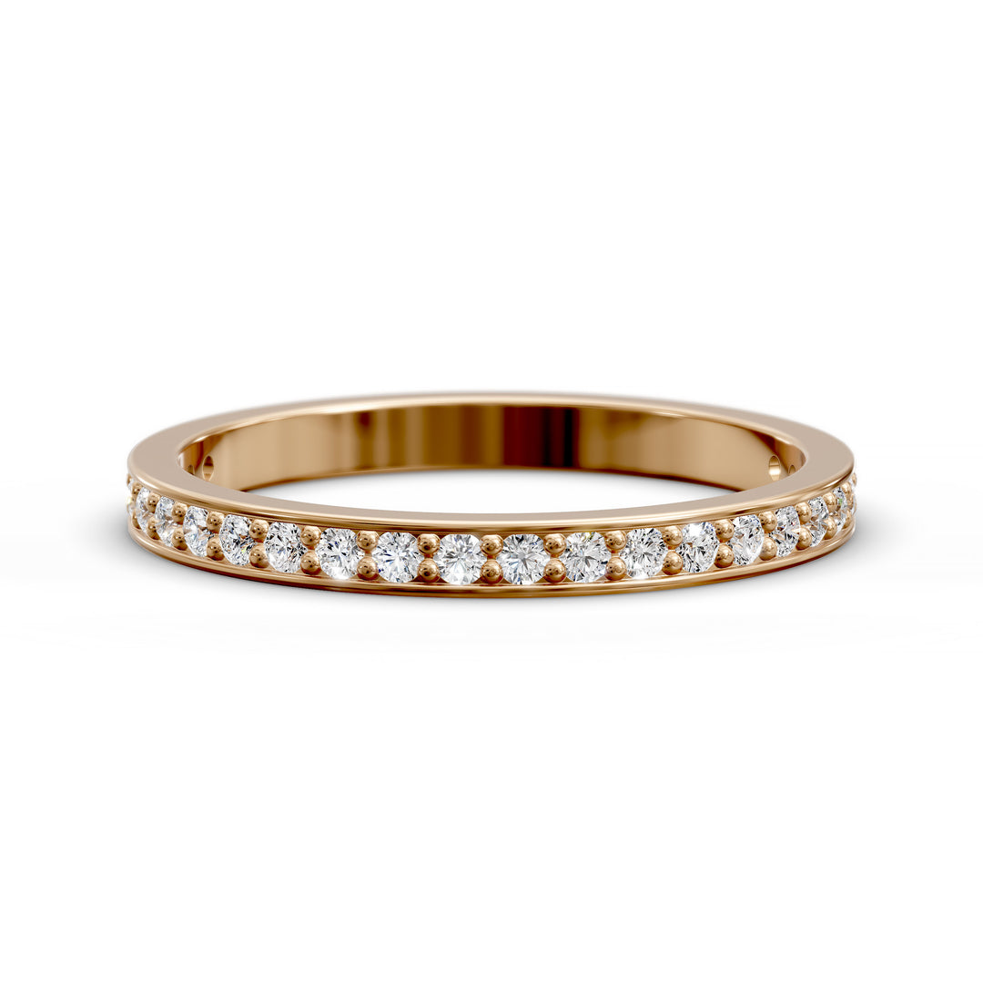 Channel set three-quarter eternity ring with round stones in polished gold