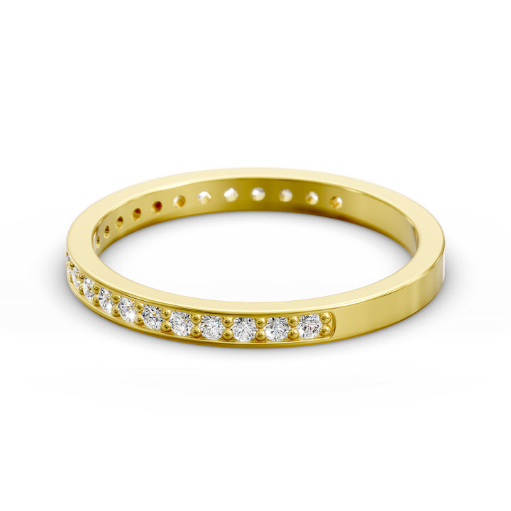 Channel set three-quarter eternity ring with round stones in polished gold