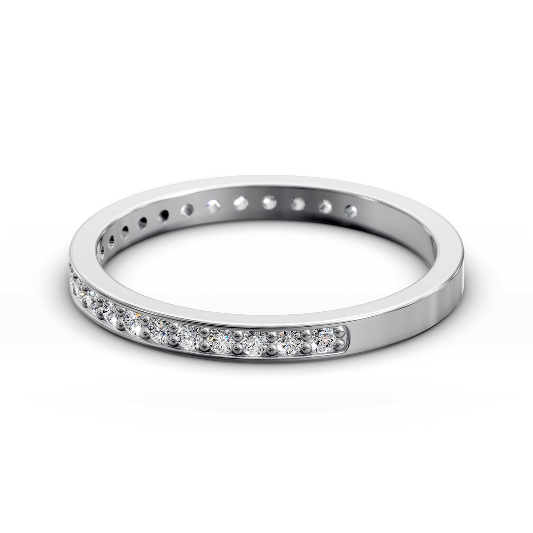 Channel set three-quarter eternity ring with round stones in polished gold