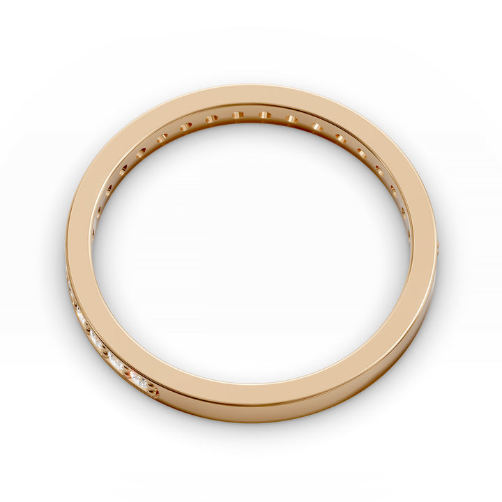 Channel set three-quarter eternity ring with round stones in polished gold