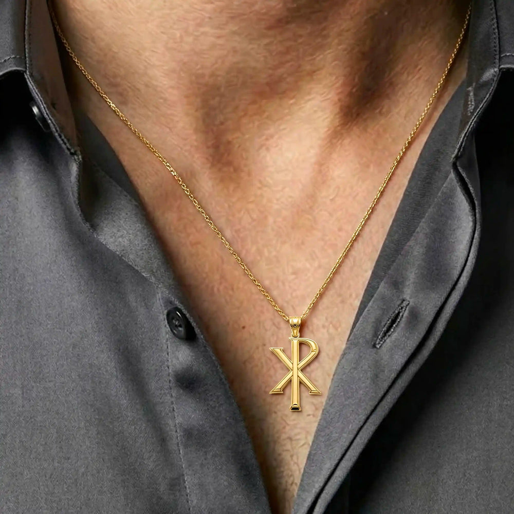 Chi Rho Christian cross pendant necklace displayed on chest.