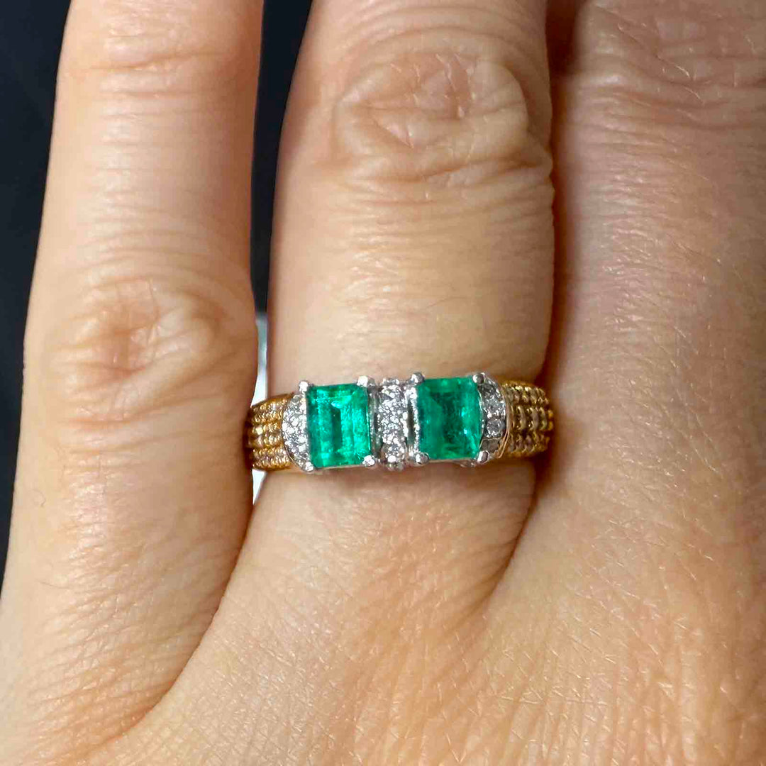 Colombian emerald ring with natural diamonds set in 18K gold.