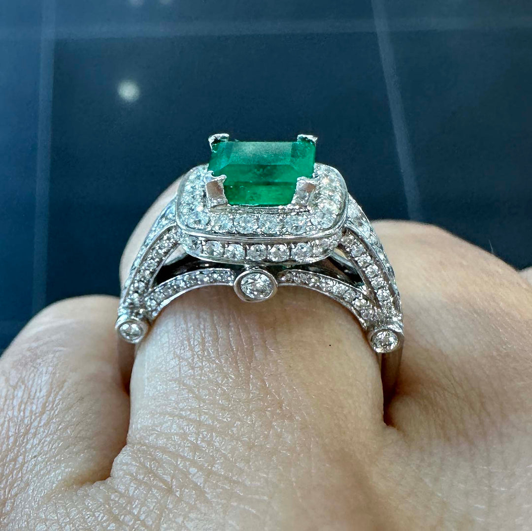 Vintage Colombian emerald ring with diamond halo in 14k white gold, 1.06ct emerald, 1.02ct diamonds.