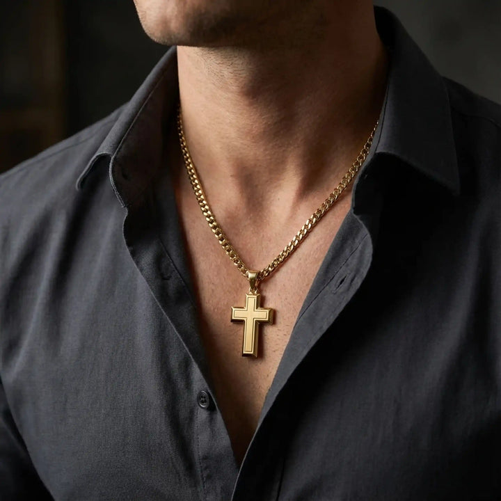 Hollow contemporary cross pendant displayed on chain over chest.