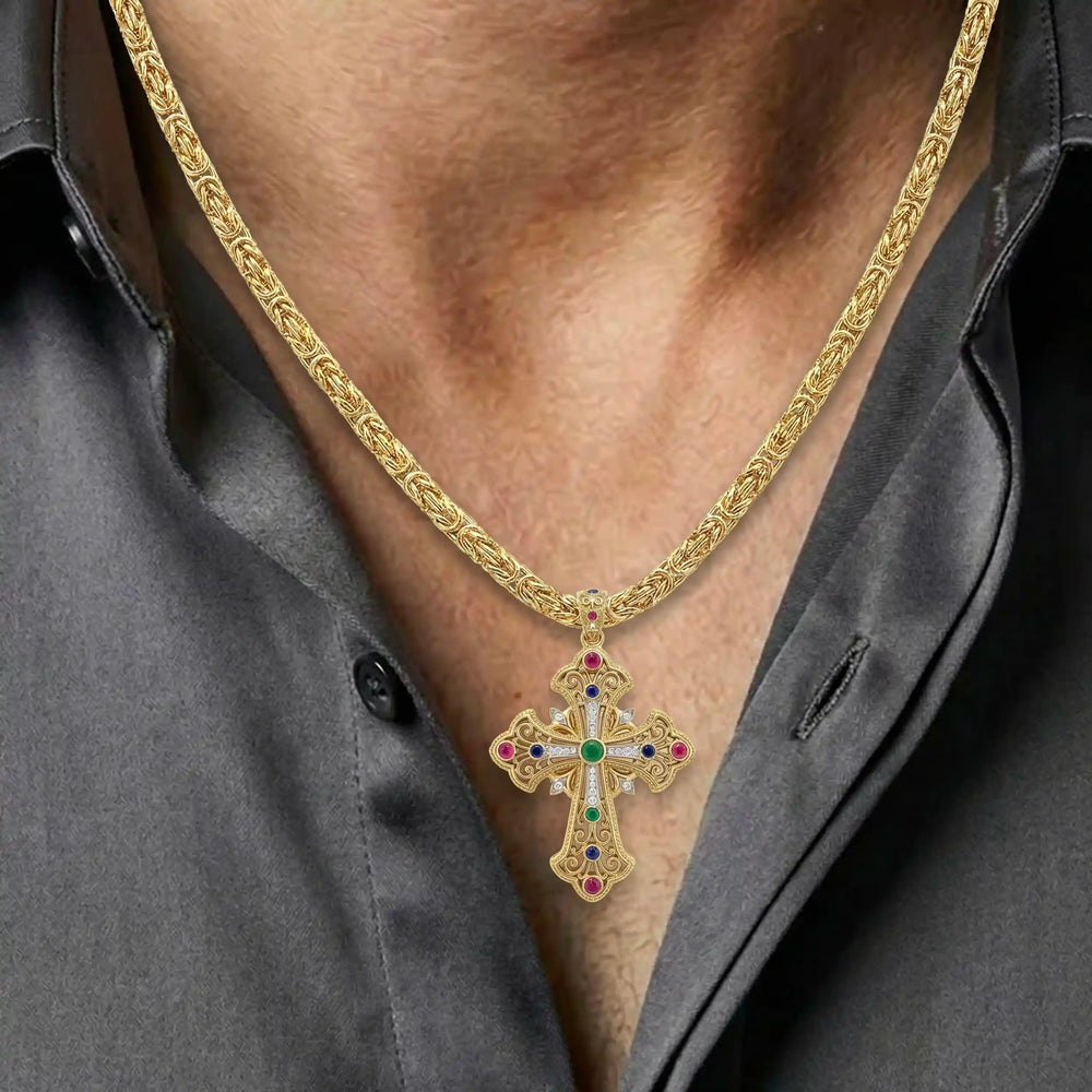 Ornate Coptic cross pendant necklace with decorative cross design displayed on chest.