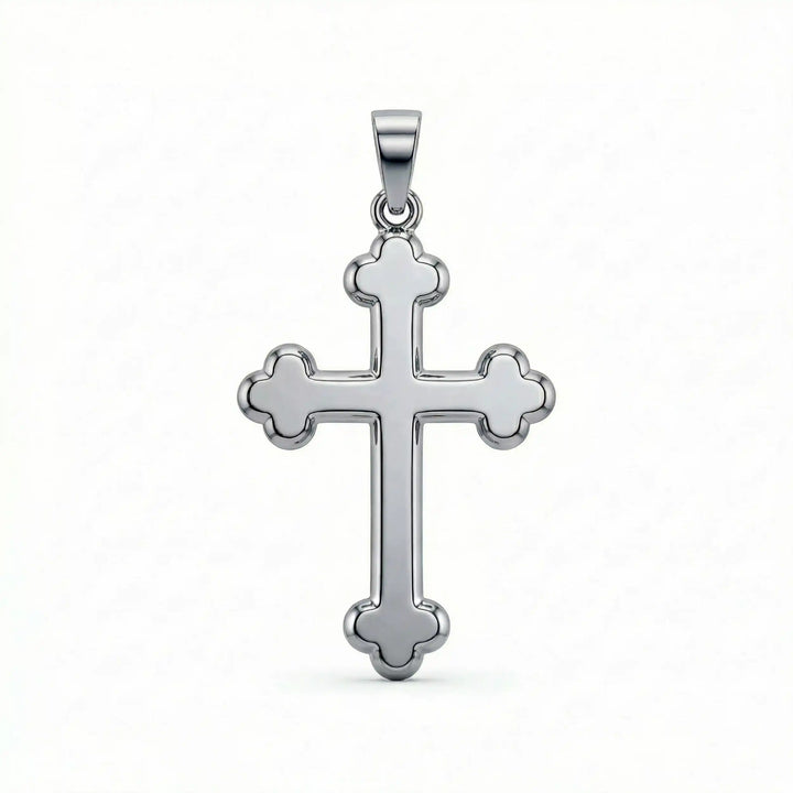 Cross fleury pendant necklace with fleur-shaped cross ends displayed on white background.