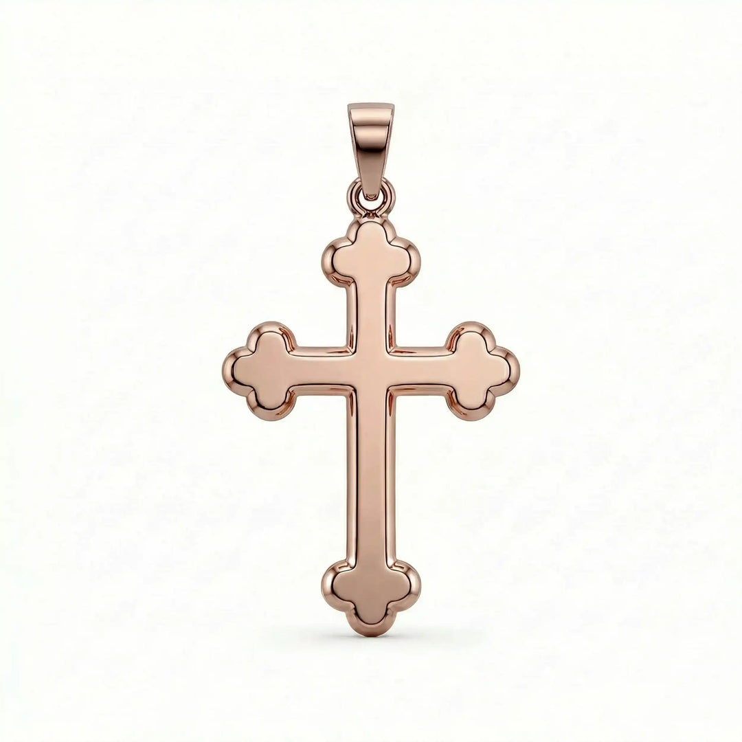 Cross fleury pendant necklace with fleur-shaped cross ends displayed on white background.