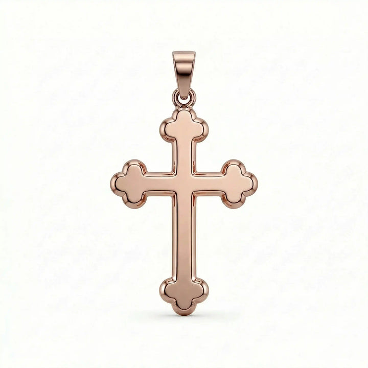 Cross fleury pendant necklace with fleur-shaped cross ends displayed on white background.