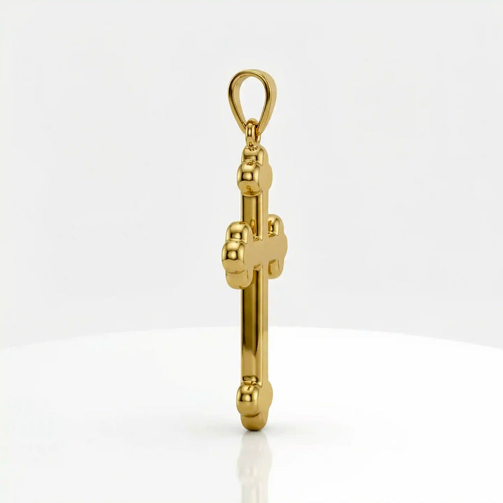 Cross fleury pendant necklace with fleur-shaped cross ends displayed on white background.