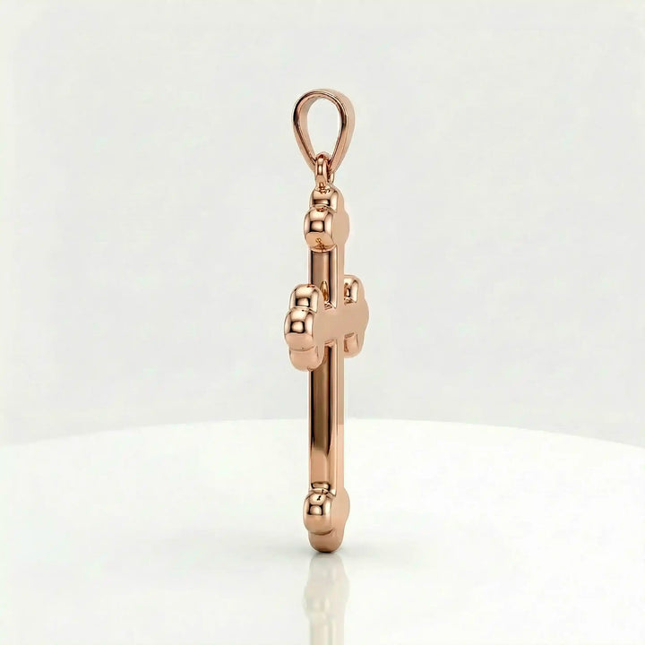 Cross fleury pendant necklace with fleur-shaped cross ends displayed on white background.