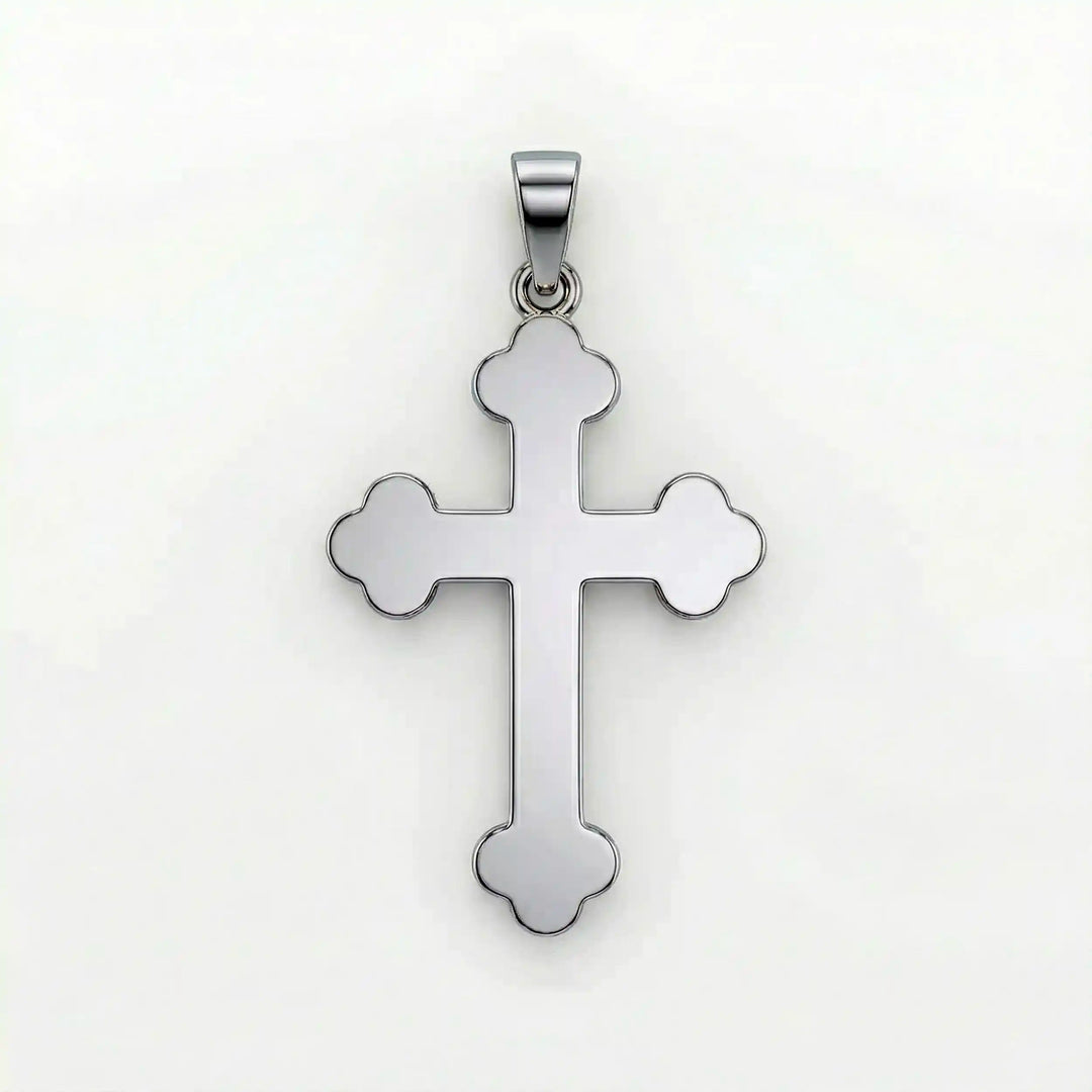 Cross fleury pendant necklace with fleur-shaped cross ends displayed on white background.