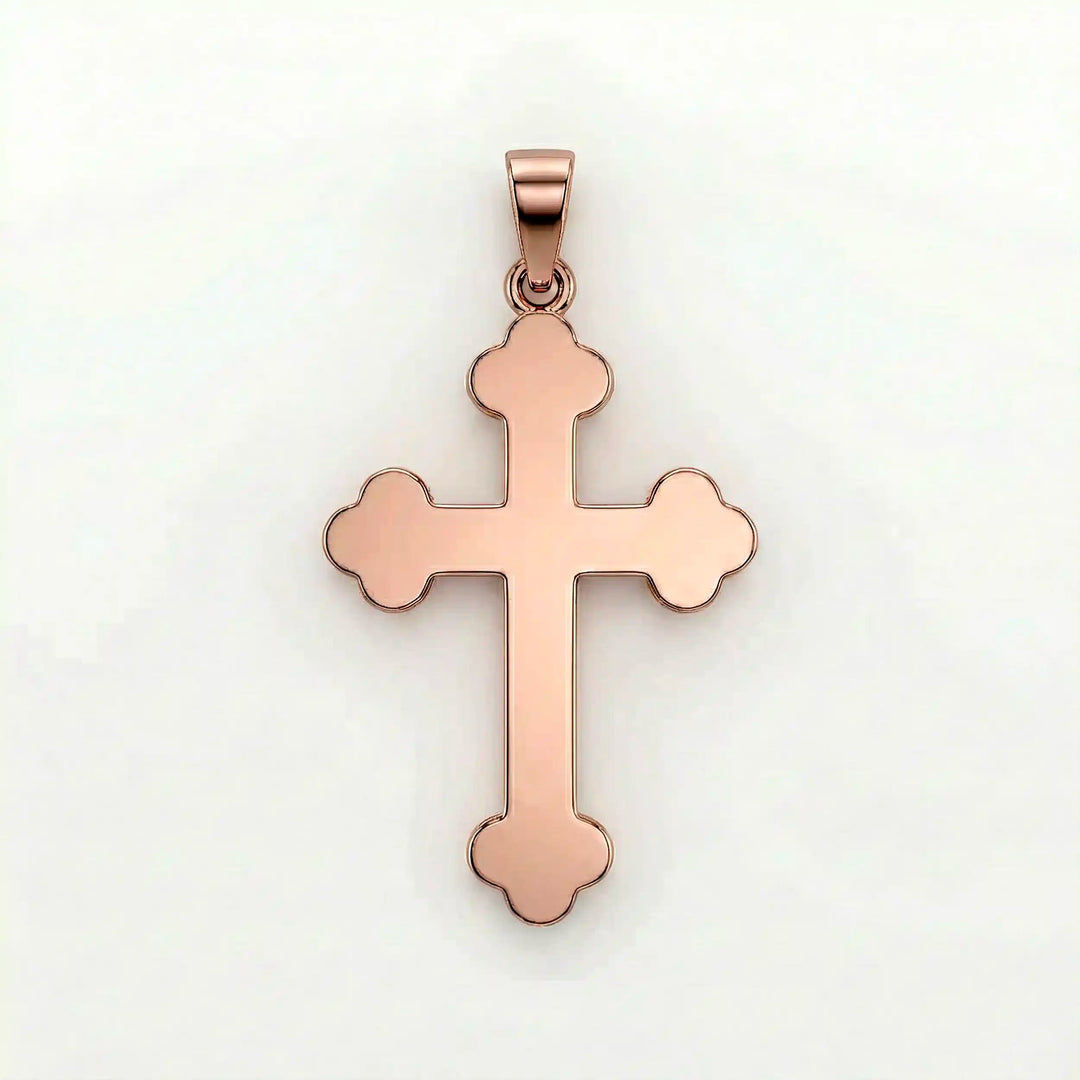 Cross fleury pendant necklace with fleur-shaped cross ends displayed on white background.