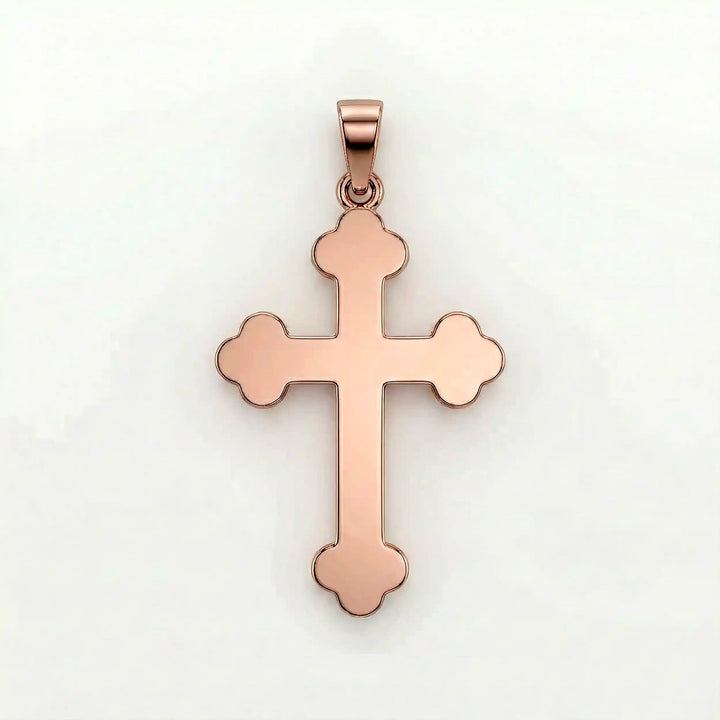 Cross fleury pendant necklace with fleur-shaped cross ends displayed on white background.