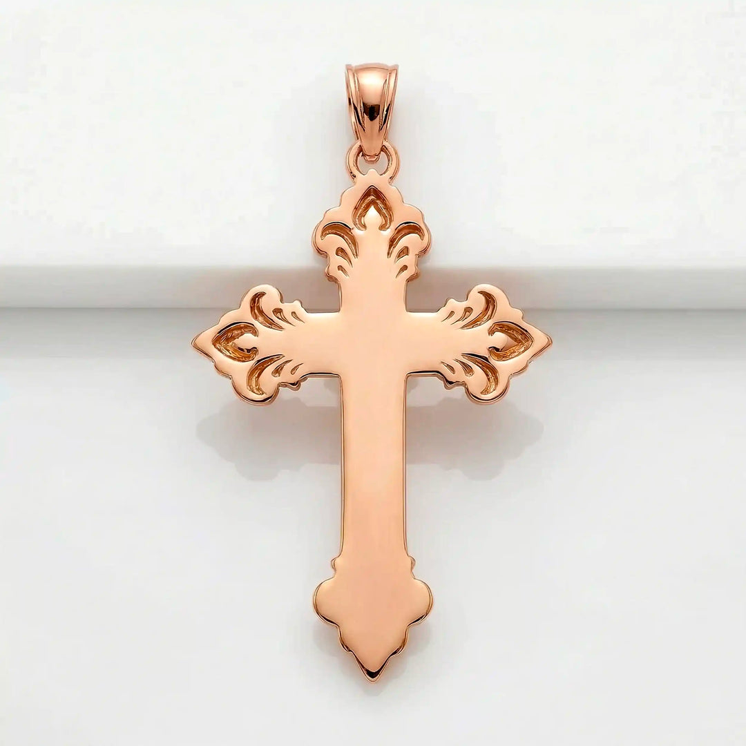 Crucifix cross pendant necklace with detailed Jesus Christ figure displayed on white background.