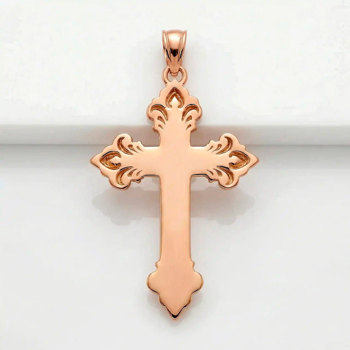 Crucifix cross pendant necklace with detailed Jesus Christ figure displayed on white background.