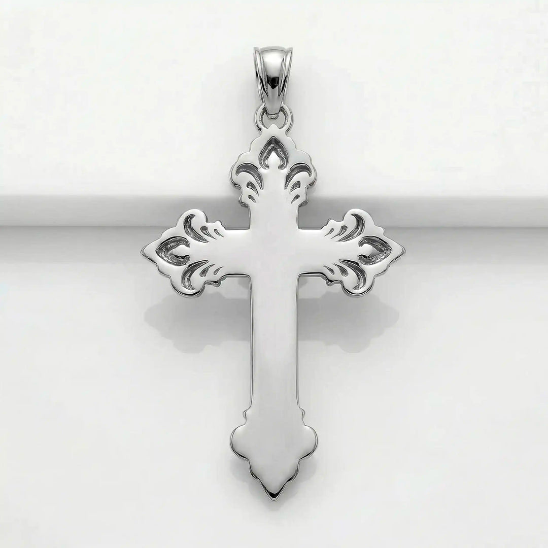 Crucifix cross pendant necklace with detailed Jesus Christ figure displayed on white background.