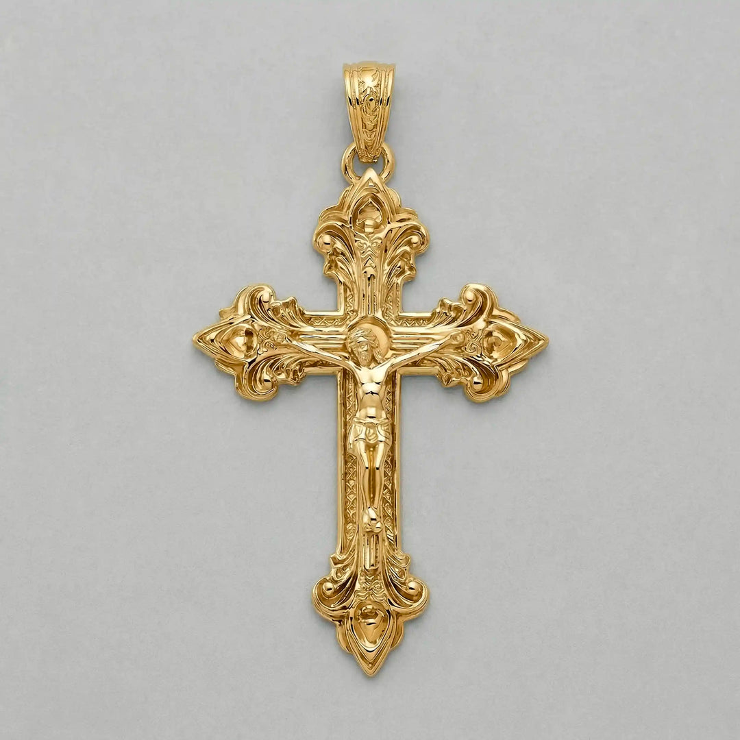 Crucifix cross pendant necklace with detailed Jesus Christ figure displayed on white background.