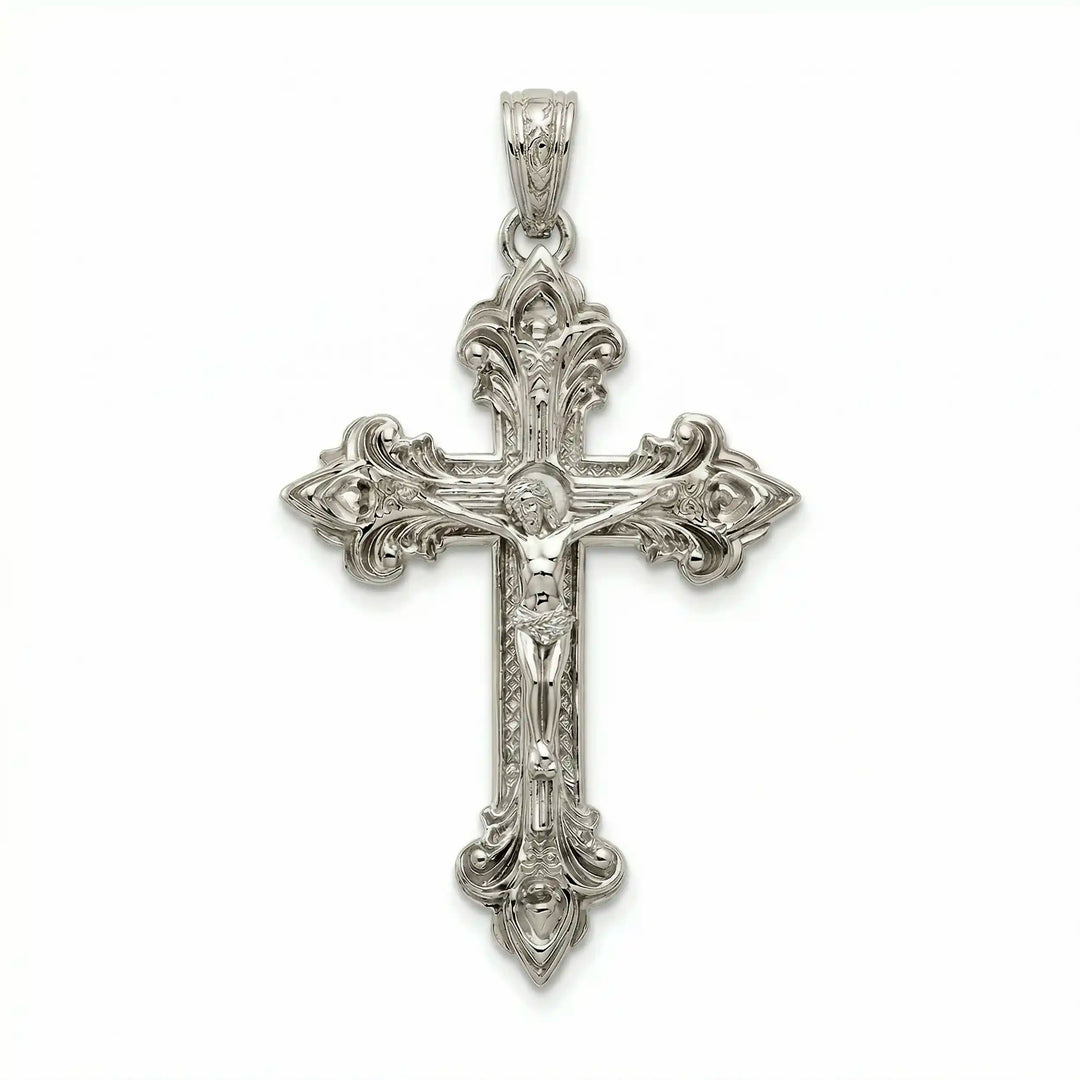 Crucifix cross pendant necklace with detailed Jesus Christ figure displayed on white background.