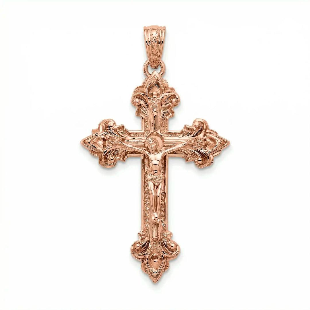 Crucifix cross pendant necklace with detailed Jesus Christ figure displayed on white background.