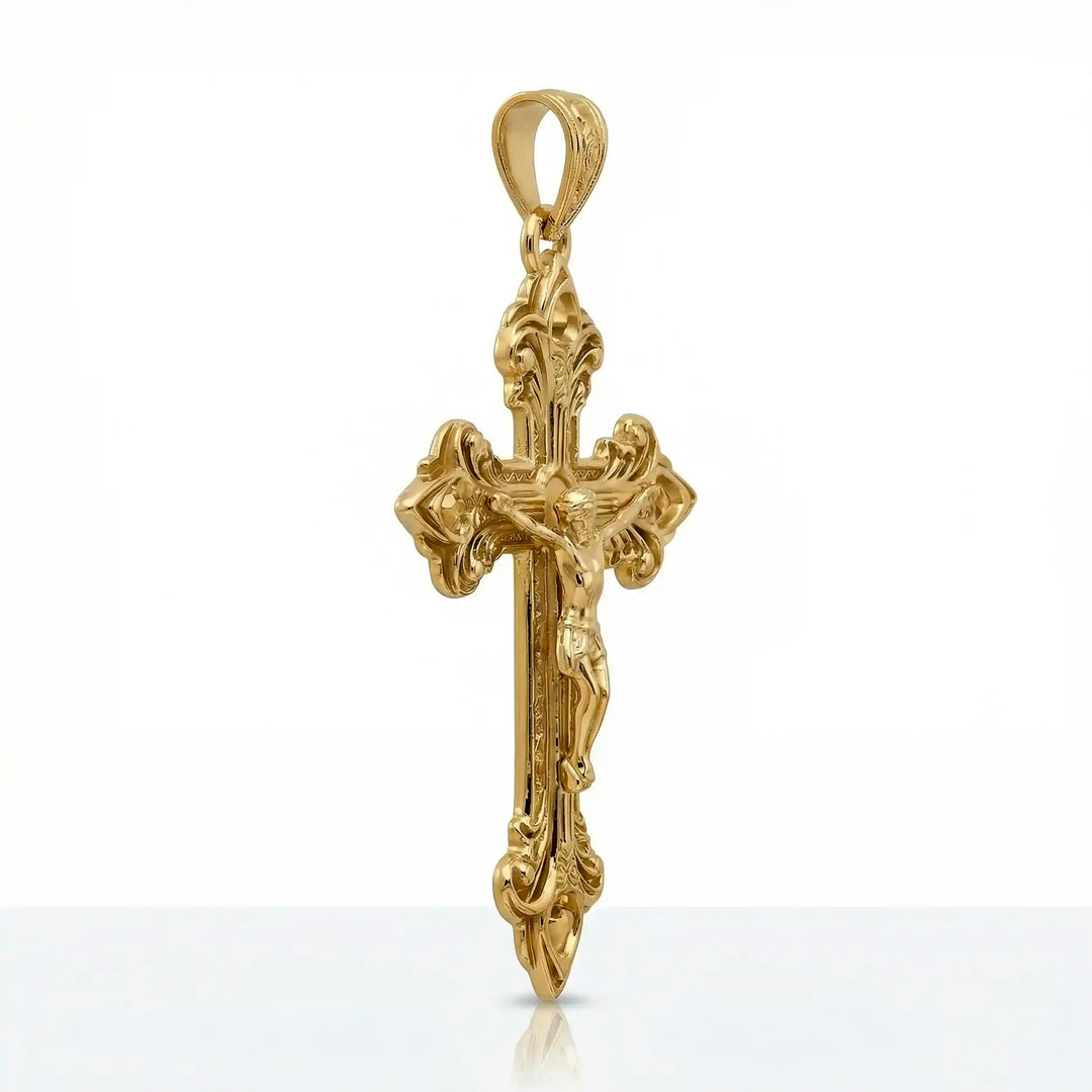 Crucifix cross pendant necklace with detailed Jesus Christ figure displayed on white background.