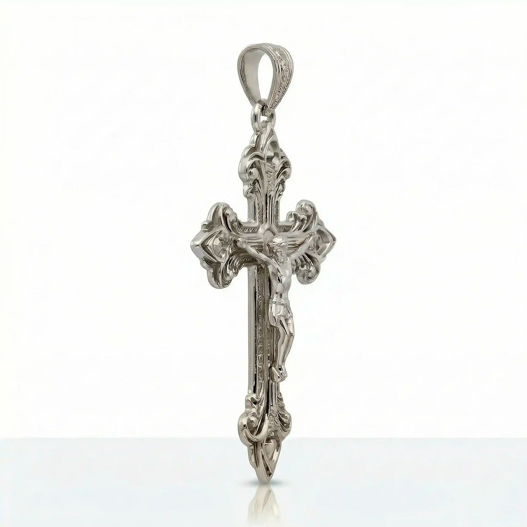 Crucifix cross pendant necklace with detailed Jesus Christ figure displayed on white background.