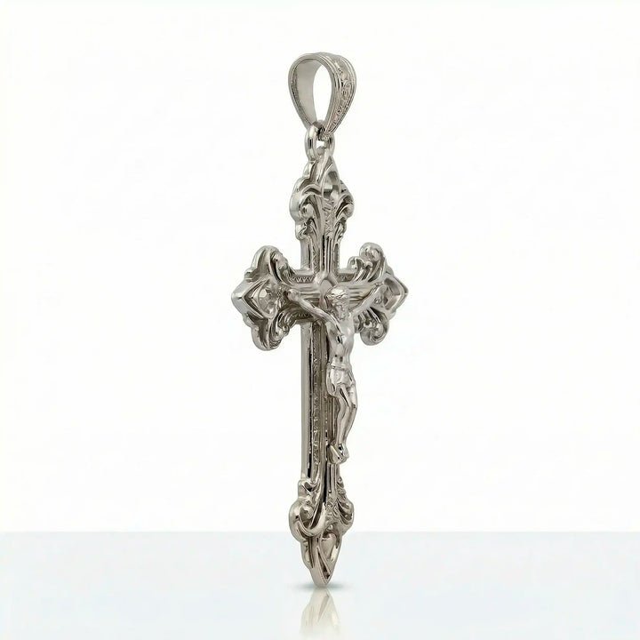 Crucifix cross pendant necklace with detailed Jesus Christ figure displayed on white background.