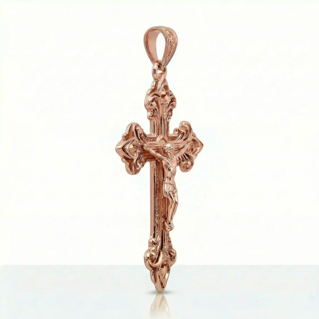 Crucifix cross pendant necklace with detailed Jesus Christ figure displayed on white background.