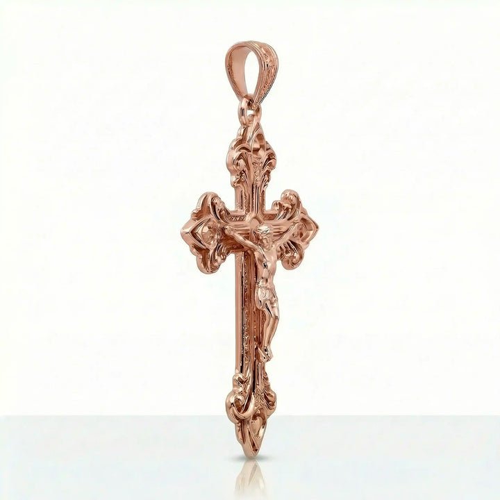 Crucifix cross pendant necklace with detailed Jesus Christ figure displayed on white background.