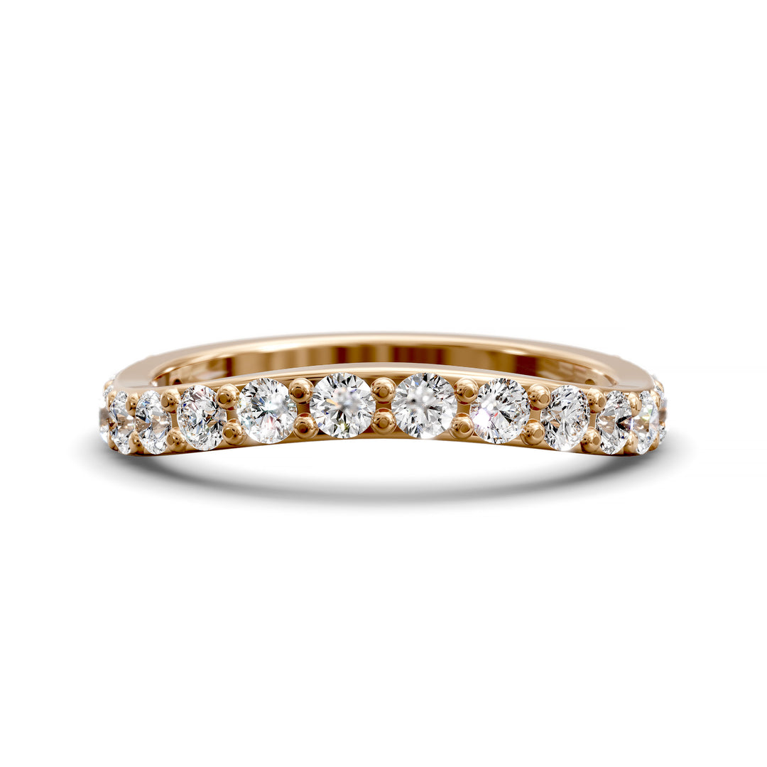 Curved half eternity diamond band with prong set round stones in polished gold